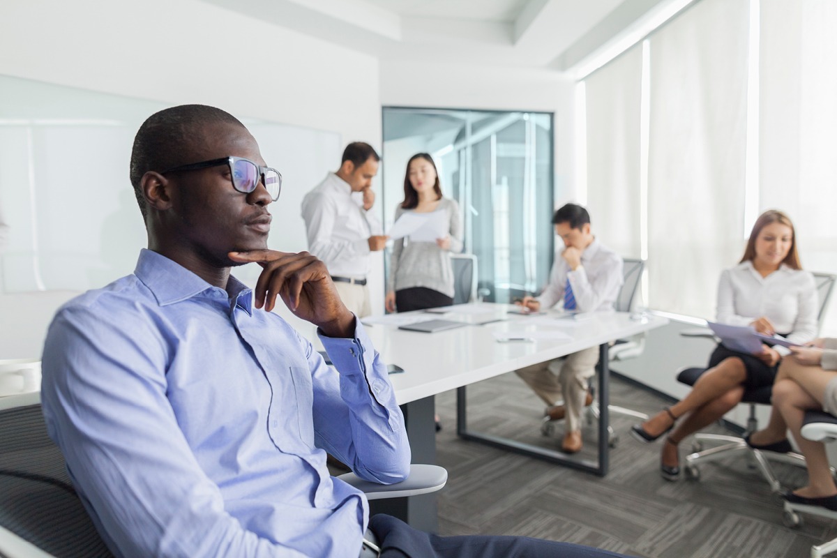 Business owner contemplating options after consulting a team of digital marketing experts providing full-service solutions for small businesses.