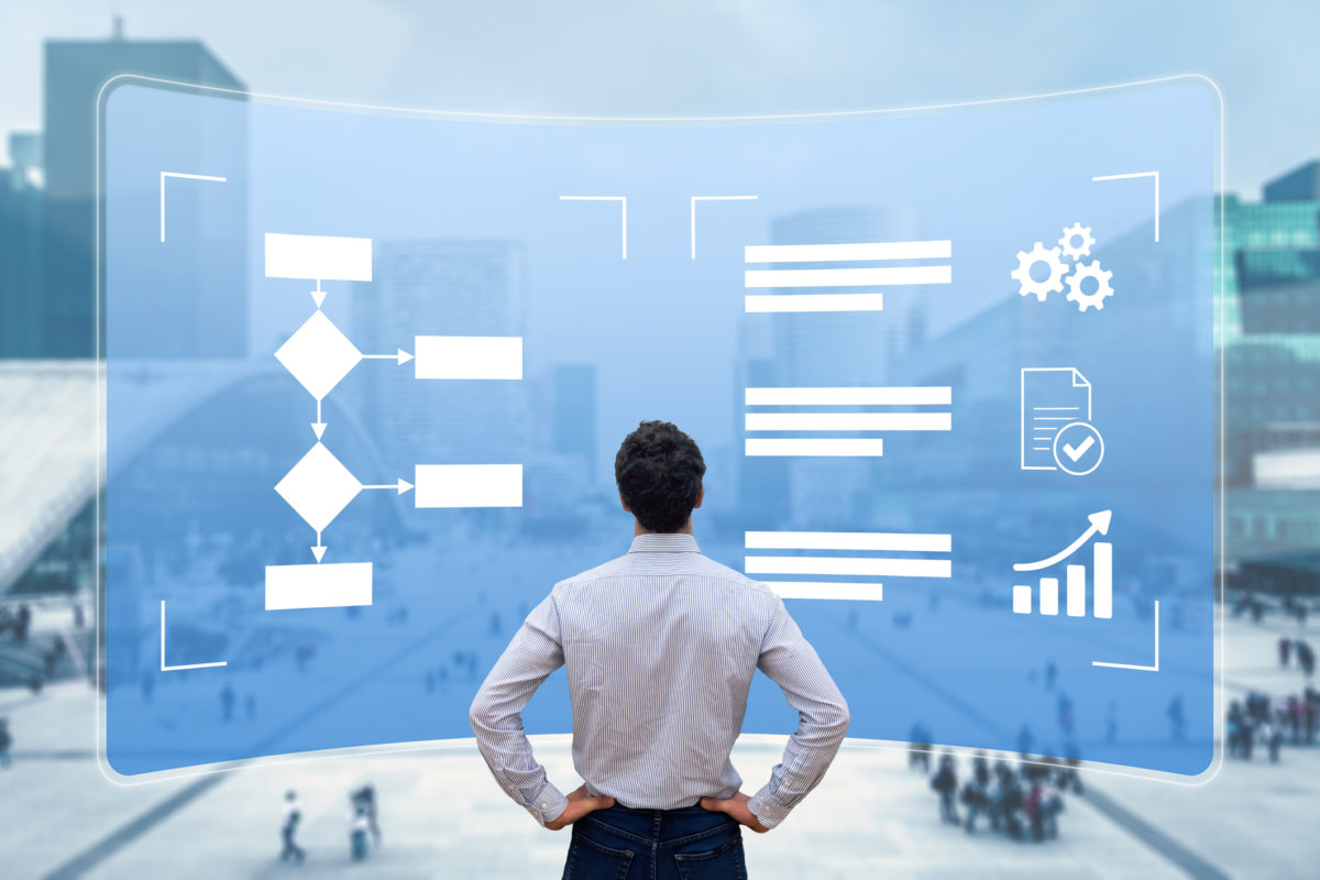 Workflow Automation Consultation looking at a flow chart finding the most efficient way to solve a small business administrative problem